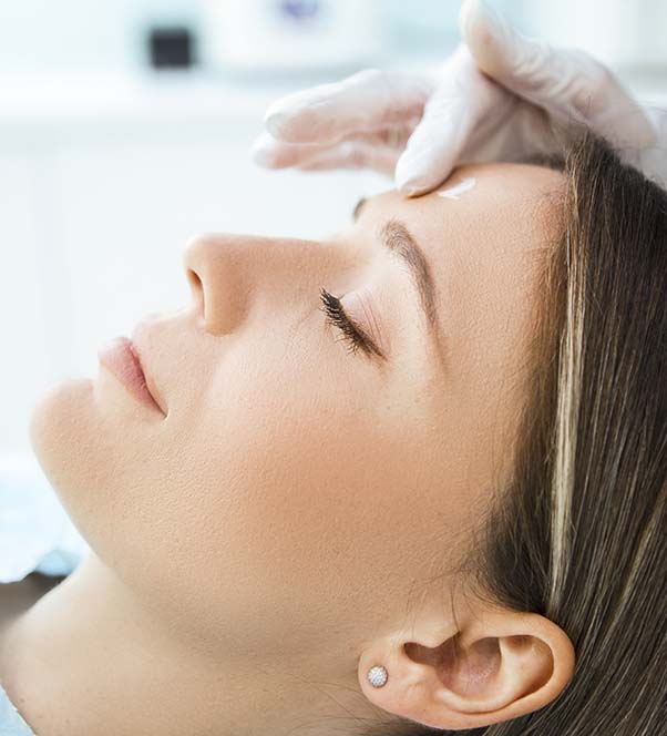 Close up of a woman starting a chemical peel treatment