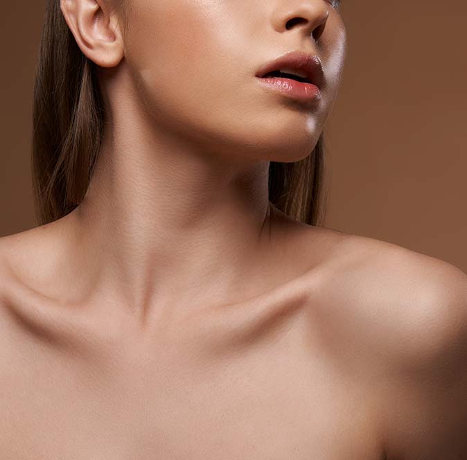 Close up of a slender neck and chin on a woman