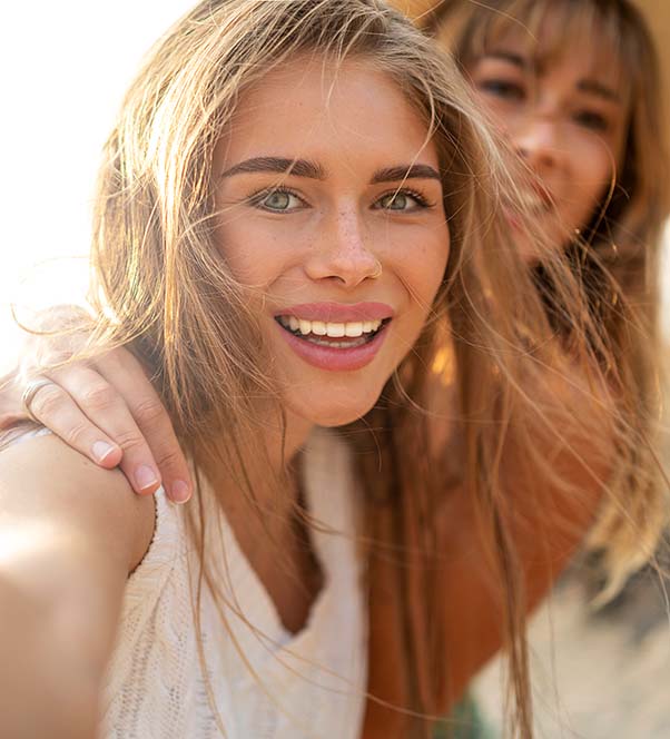 Two women with great skin taking selfies together