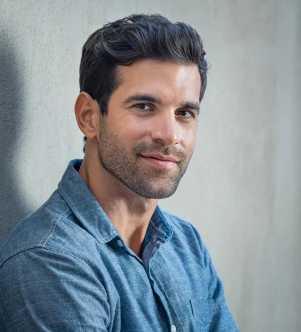 man looking into camera smiling